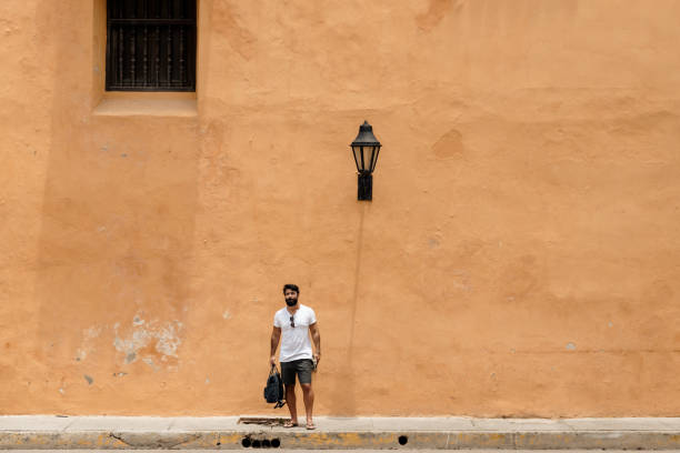 istock Man standing on the sidewalk 1417912719