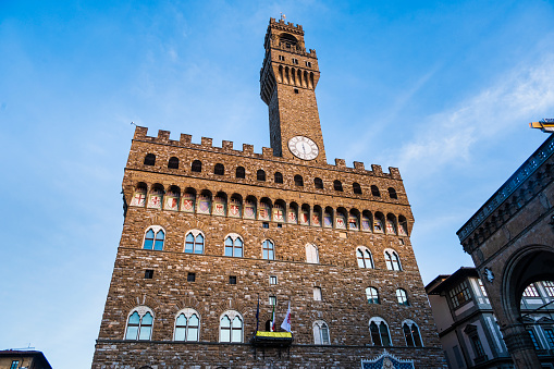 Palazzo Vecchio with a blue sky in the background