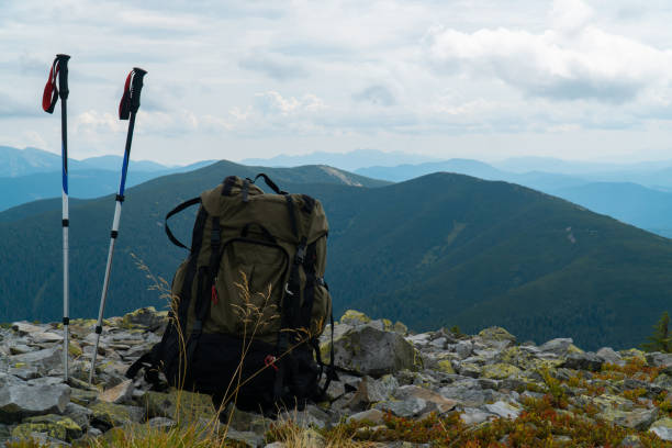 tourist backpack in the mountains. green hiking backpack.