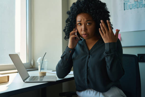 istock Saddened multiracial woman talking on the phone 1417915438