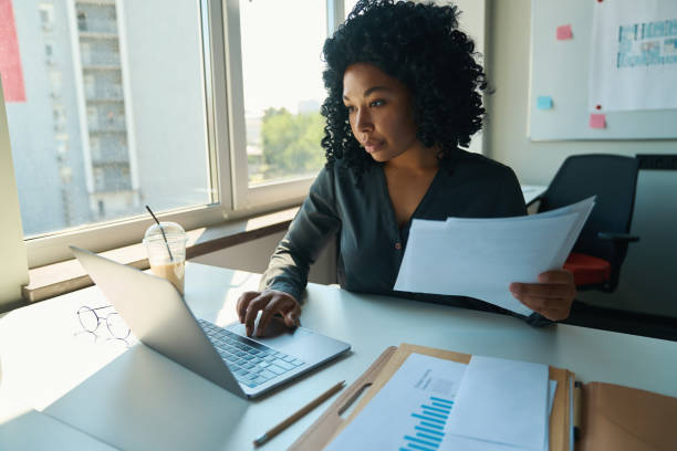 istock Woman working on a computer in the office 1417915474