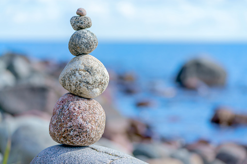 Close-up view of balanced stones on the beach