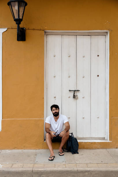 istock Man sitting on the sidewalk 1417916919