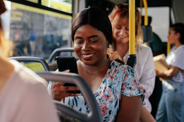 istock African american woman texting on bus 1417918594