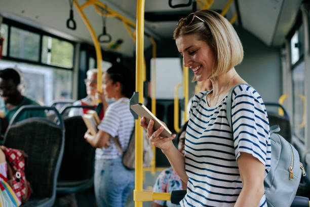 istock Caucasian woman texting on city bus 1417918596