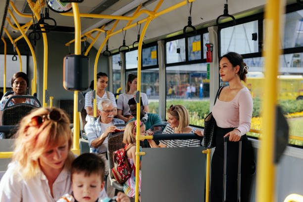 istock People on crowded airport shuttle 1417918598