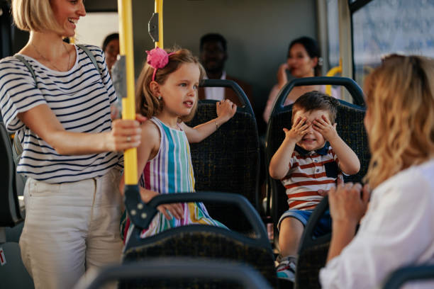 istock Moms with children in public bus 1417918605