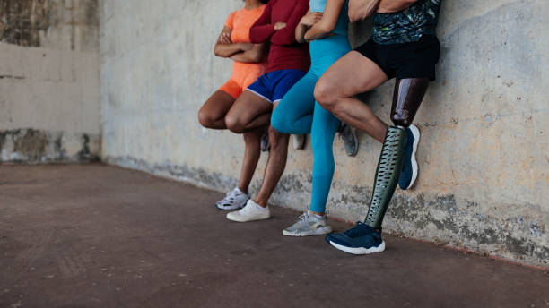 Legs of diverse athletes close up stock photo