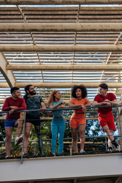 istock Group of friends resting after jogging 1417920252