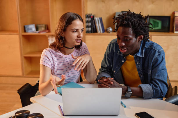 istock Two Students Studying Together in College 1417921779