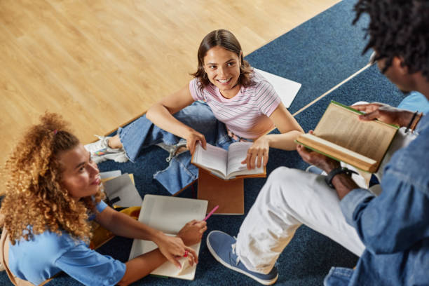 istock Group of Students Relaxing in Lounge 1417921789