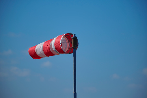 Windsock indicator of wind on runway airport.