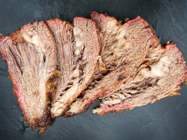 istock Sliced beef brisket on black slate board. Directly above 1417928366