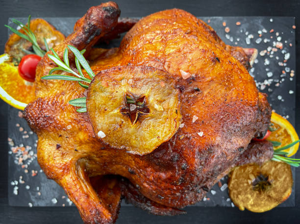 istock Baked chicken on dark background. Top view, close up 1417928391