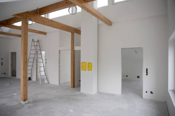 istock attic construction site freshly painted, the floor is still screed, walls are white 1417929853