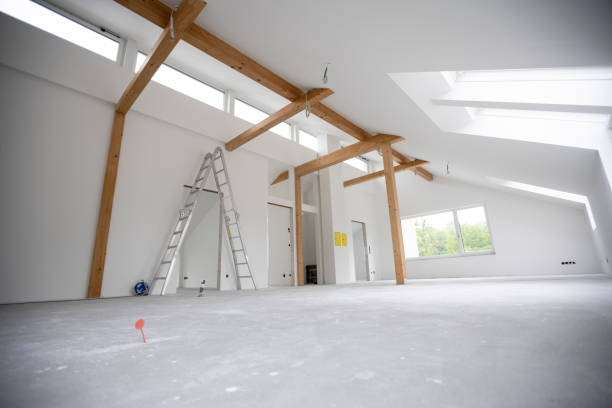 istock attic construction site freshly painted, the floor is still screed, walls are white 1417931222