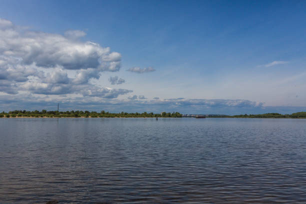 istock White heap clouds in the sky above the river 1417933654