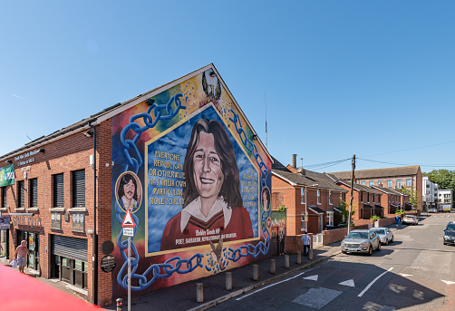 Belfast, UK. 12 August 2022. Painted murals on the side of buildings in Belfast mark 