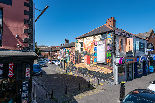 Belfast, UK. 12 August 2022. Painted murals on the side of buildings in Belfast mark \