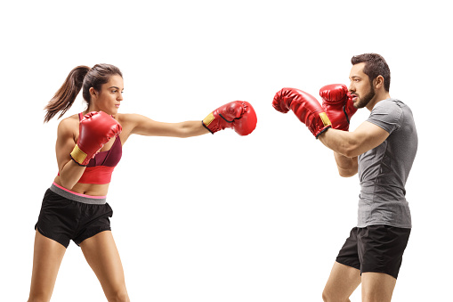 Man and woman fighting with boxing gloves isolated on white background