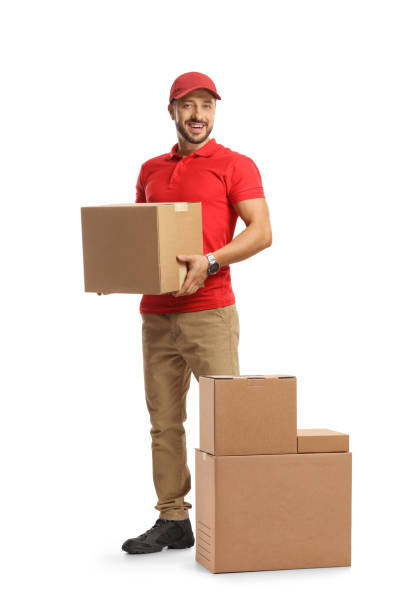 istock Male courier holding a cardboard box 1417941318