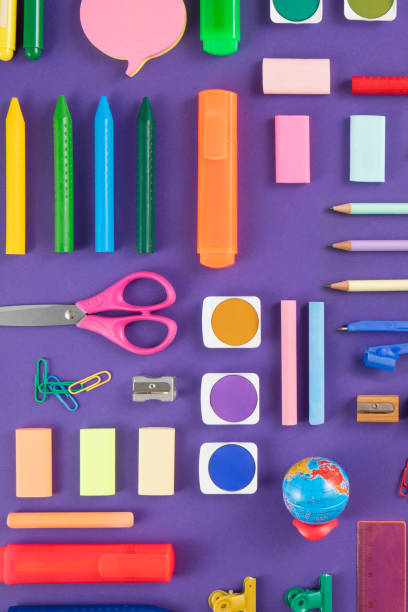 istock School Supplies on Purple Background 1417945879