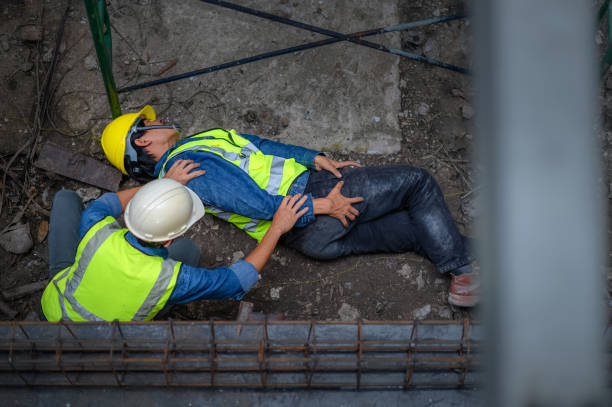 istock A young Asian builder falls from a scaffold at a construction site. An engineer supervising the construction came to the aid of a construction worker who fell from a height with hip and leg injuries. 1417946035