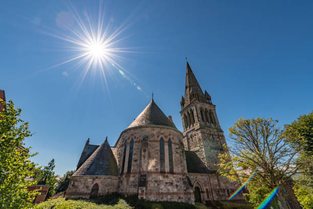 Sun rays over a church in Belfast