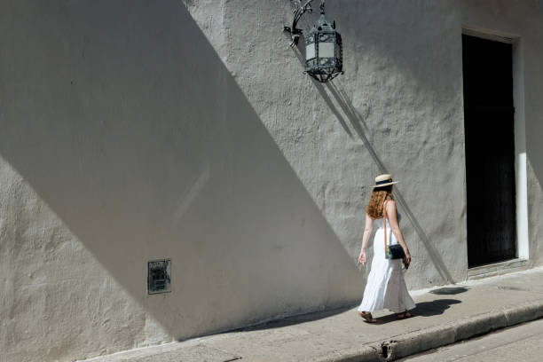istock Girl walking on the sidewalk 1417949329