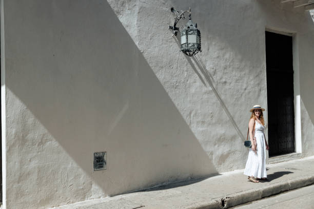 istock Girl walking on the sidewalk 1417949381