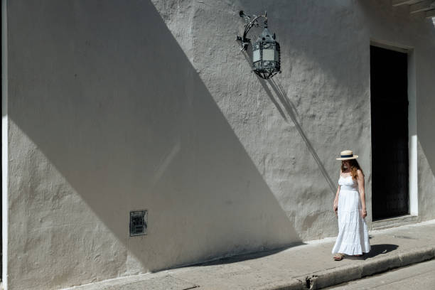 istock Girl walking on the sidewalk 1417949386