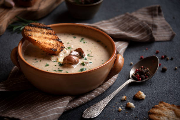 istock Creamy porcini mushroom soup in a rustic bowl 1417954854