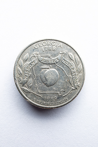 Coin on white. Soft Lighting with Soft Shadow.\n\nGeorgia Quarter 25 cents 1999