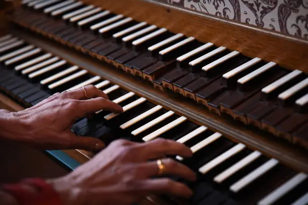 Mature Female Hands Playing Harpsichord aka Cembalo Musical Instrument.