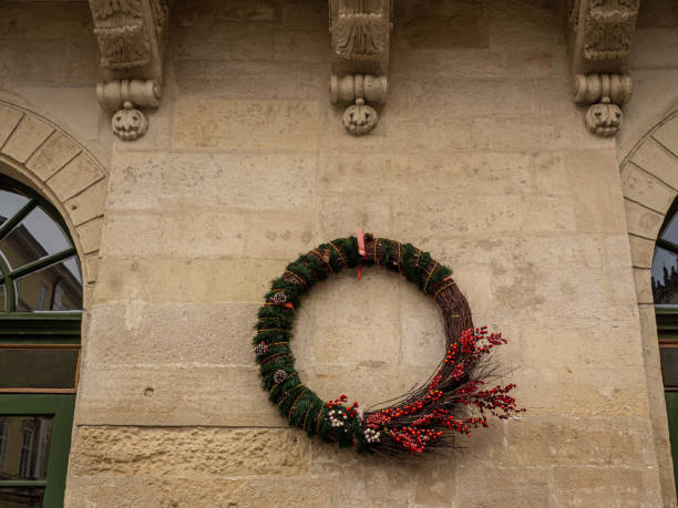 istock Christmas wreath hanging on the wall 1417967522