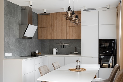 White kitchen with wood details and concrete tile