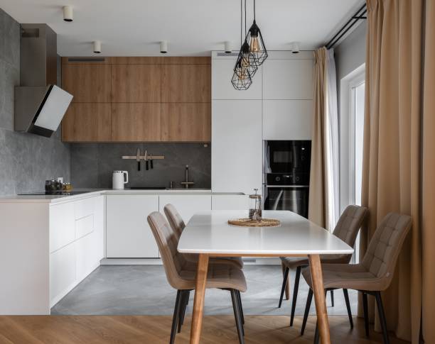 istock White kitchen with wood details and concrete tile 1417968140