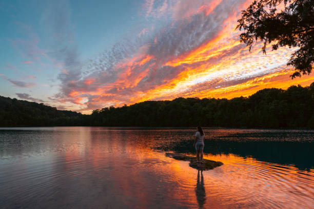 woman doing hike around lake