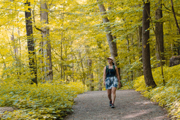 istock woman doing hike around lake 1417968225