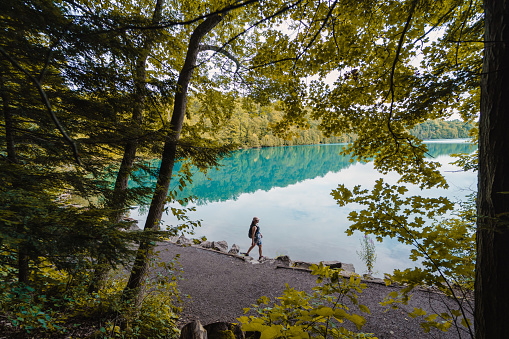 woman doing hike around lake