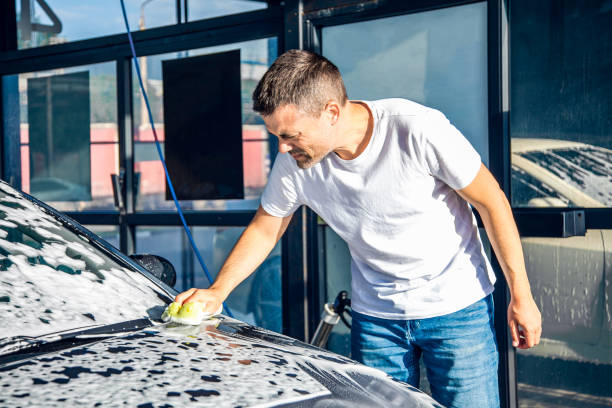 istock A man washes his car with foam at a self-service car wash 1417974534