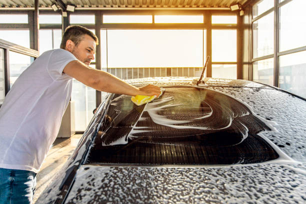 istock A man washes his car with foam at a self-service car wash 1417974544