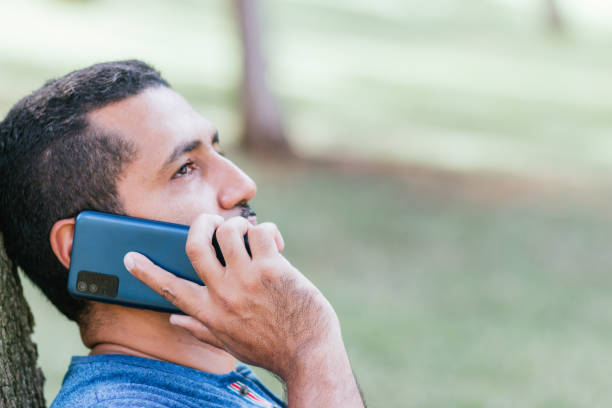 istock man talking on portable phone from park 1417974883