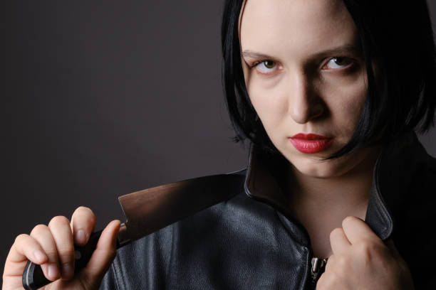 istock woman with knife 1417978091
