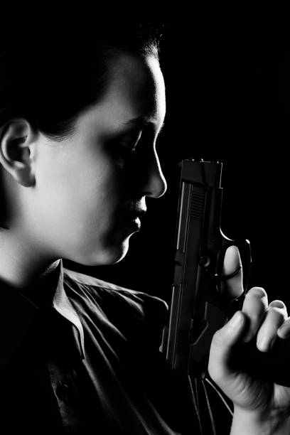istock woman with gun 1417978305