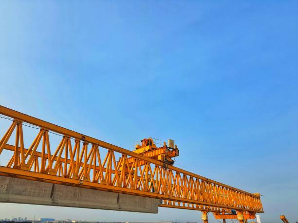 istock This is the steel structure of a launcher gantry that will be used for erection precast concrete I Girder (PCI Girder). 1417978398