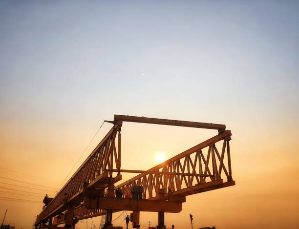 istock This is the steel structure of a launcher gantry on sunset that will be used for erection precast concrete I Girder (PCI Girder). 1417979380