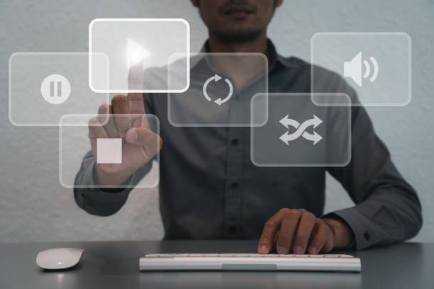 istock Man business using mouse and keyboard for streaming online, watching video on internet, live concert, show or tutorial 1417989723