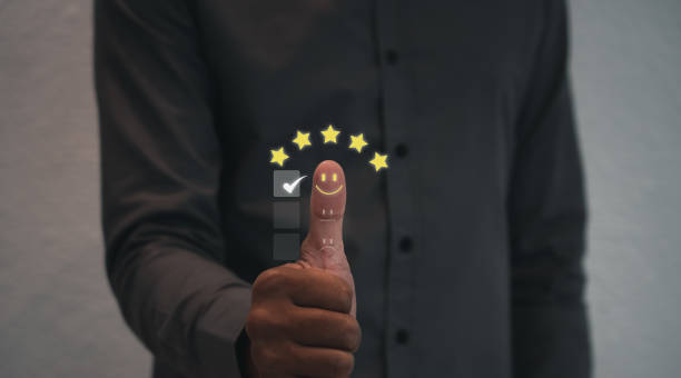 istock Customer satisfaction concept. thumb up Positive emotion smile face and five star, feedback, service, survey, standard quality. User give rating to service experience, certification. 1417991048