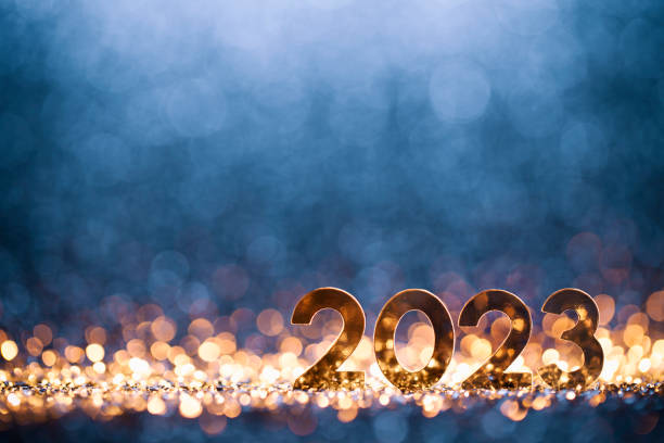Happy New Year 2023 - Christmas Gold Blue Glitter Golden numbers 2023 on wonderful defocused lights in a yellow blue contrast. Native image size: 5616x3744 2023 stock pictures, royalty-free photos & images